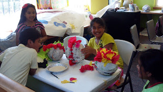 pinata making children at milagro theatre summer art camp